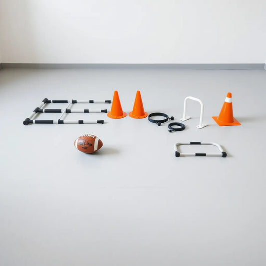 Neatly arranged football training tools including cones, ladder, hurdles, and a ball on a clean floor