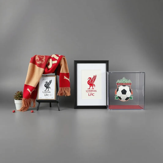 Neatly displayed football memorabilia including a scarf, framed retro print, and protected signed card on a dark background