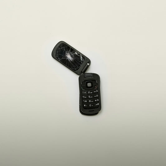 broken black flip phone 