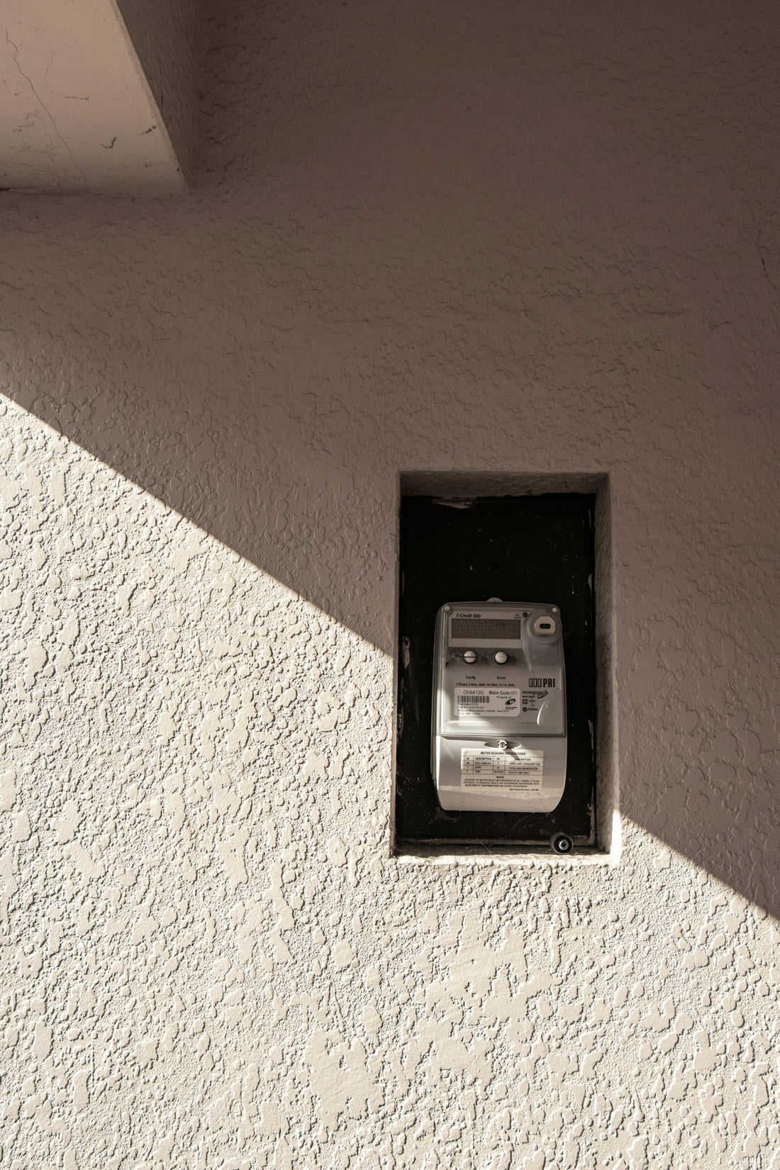 a cell phone that is on the side of a building