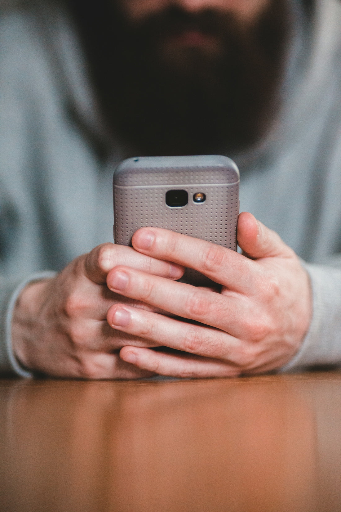 person holding silver iphone 6