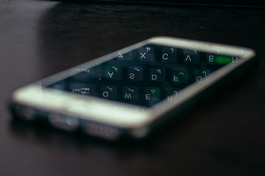 a close up of a cell phone on a table