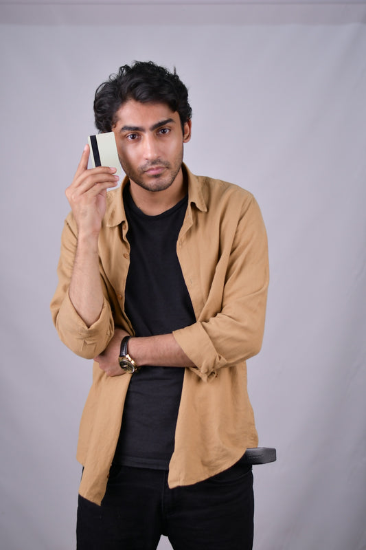 a man holding a cell phone up to his face